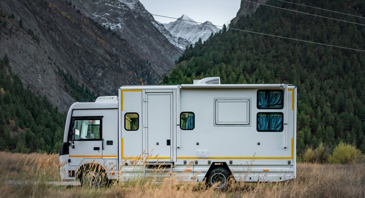Caravan with scenic mountain backdrop