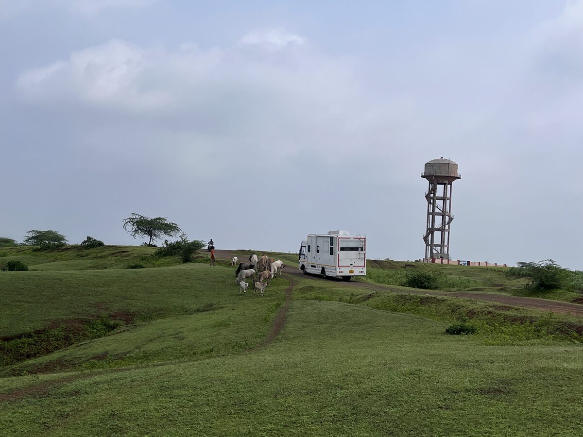 Caravan on a misty rain-washed hill road